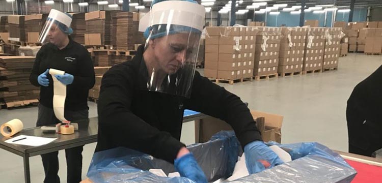 An image of factory workers on shift at Transcend Packaging